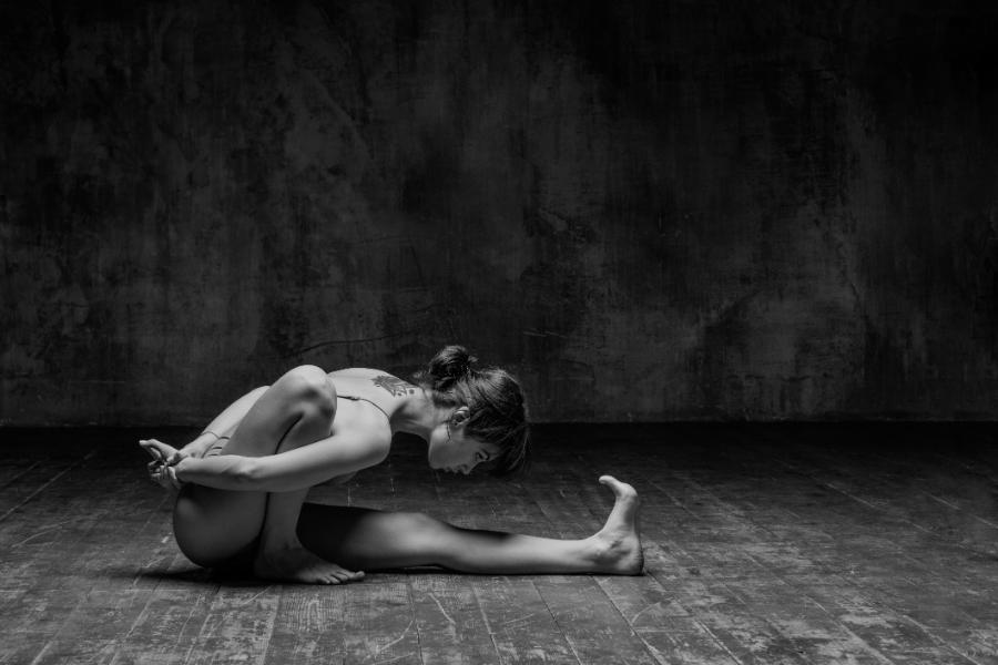 A woman slims down as she stretches her body for great flexibility